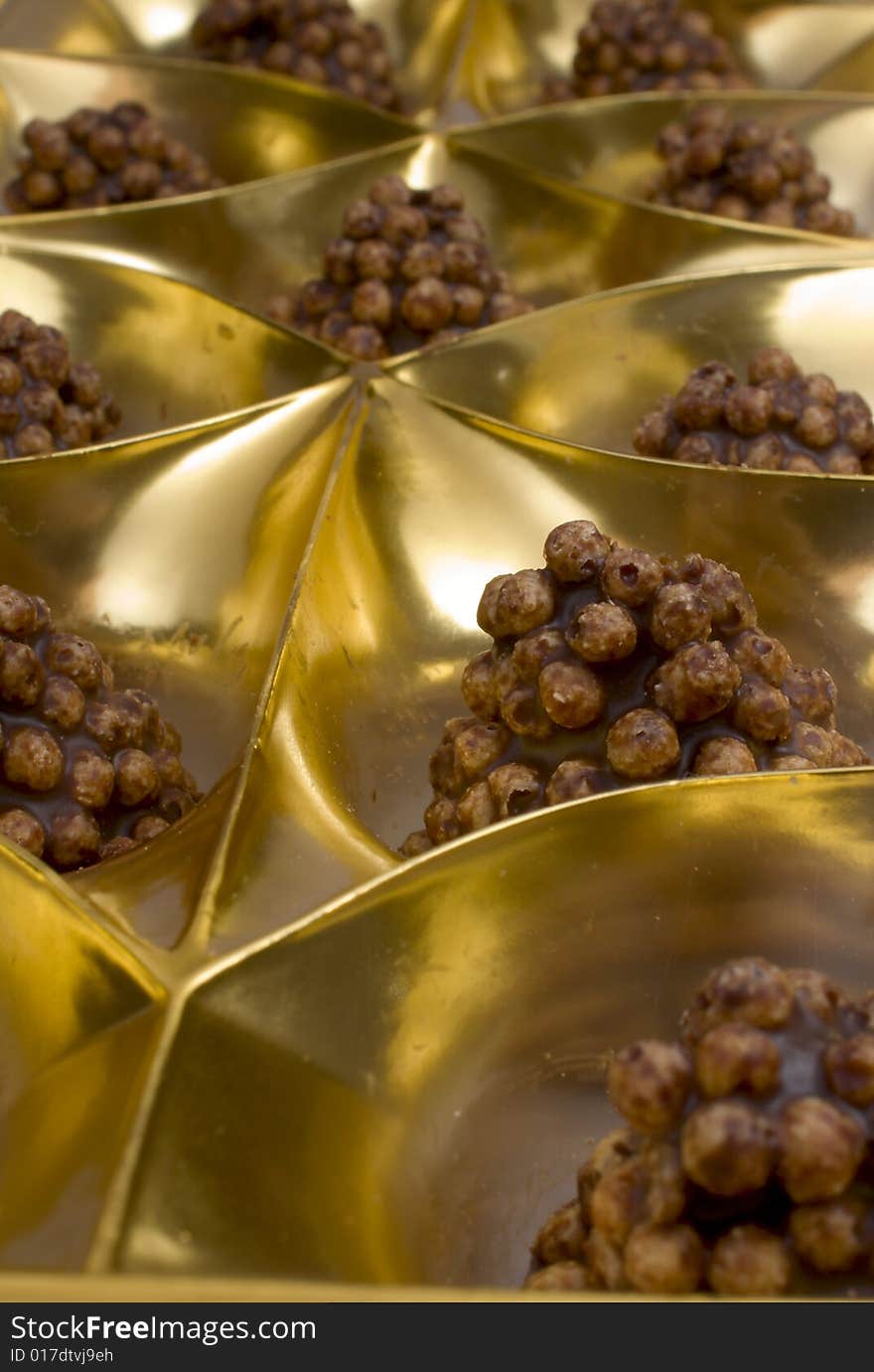 Chocolate sweets in packing from a golden foil