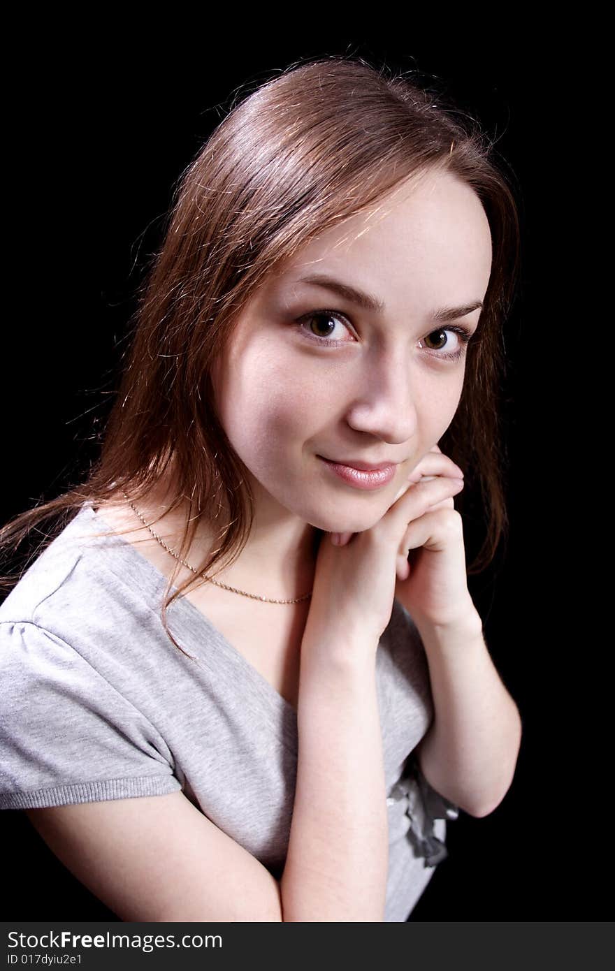 Nice young girl on a black background. Nice young girl on a black background