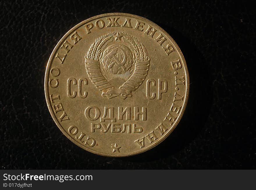 Isolated old soviet ruble against the black background