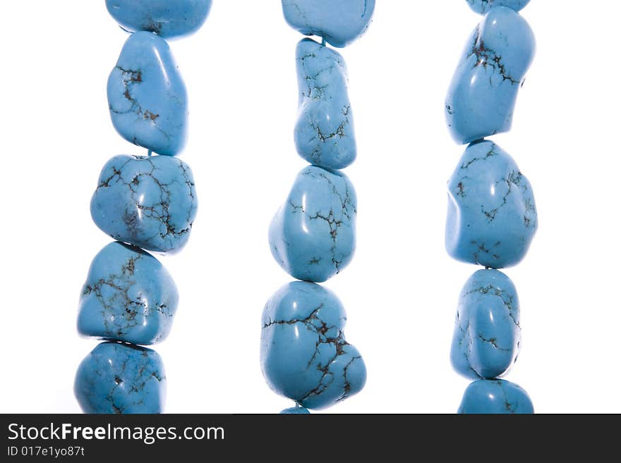 Turquoise beads isolated on white background