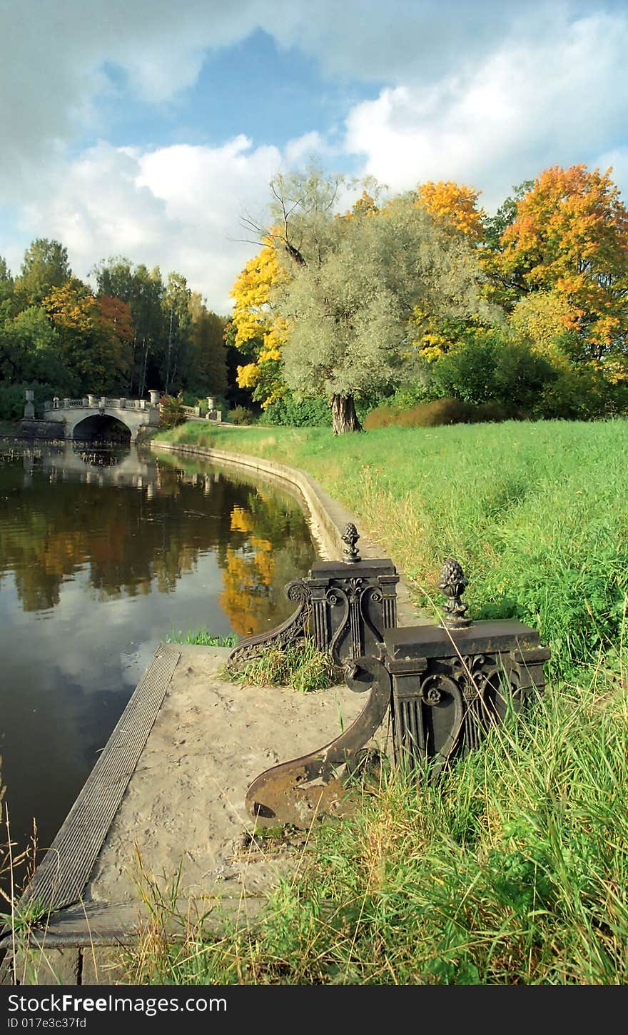 Old pier in old autumn park. Old pier in old autumn park