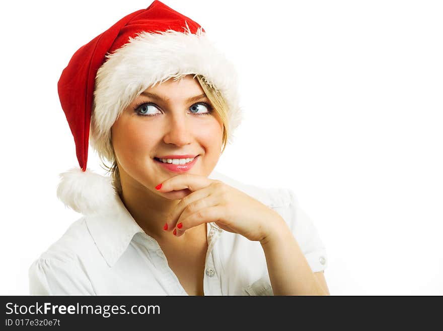 Girl in Santa hat dreaming about.... Isolated on white.