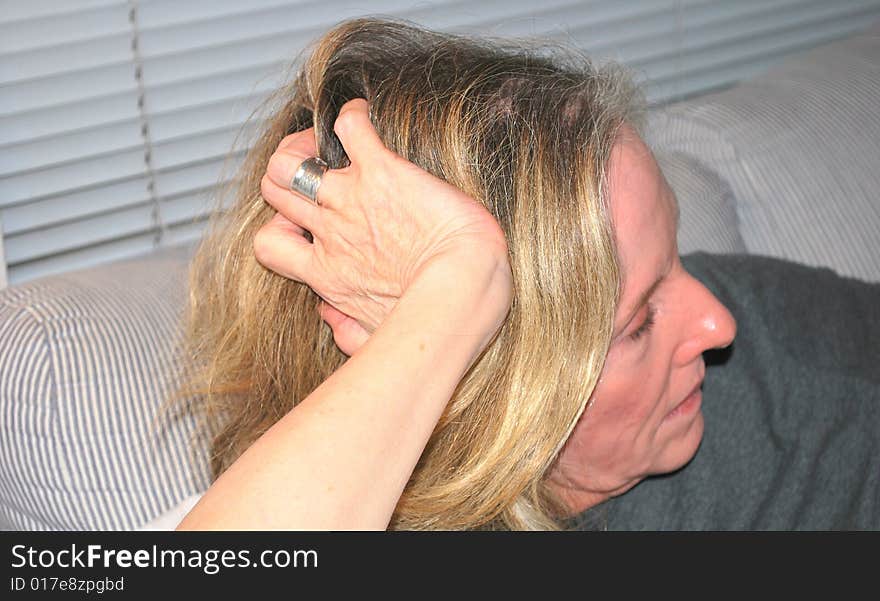 Mature female beauty relaxing at home.