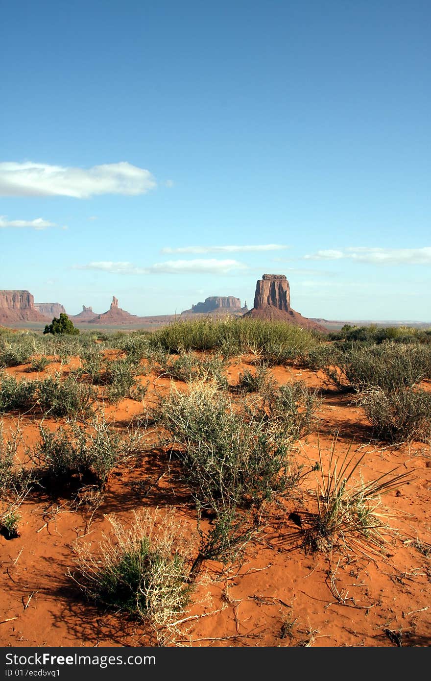 Arizona's Monument Valley, looking from the distance with the desert foreground. Arizona's Monument Valley, looking from the distance with the desert foreground