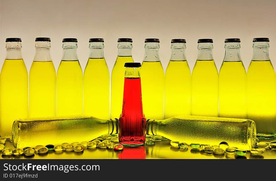 Row of yellow and red drinks against white background. Row of yellow and red drinks against white background