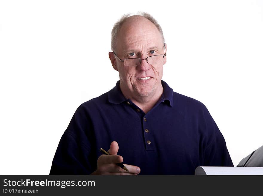 An older man presenting a deal or proposal in a notebook. An older man presenting a deal or proposal in a notebook