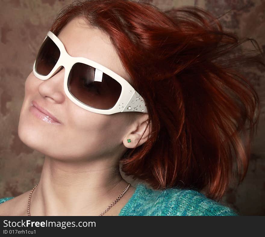 Young glamorous girl with white sunglasses smiling portrait. Young glamorous girl with white sunglasses smiling portrait