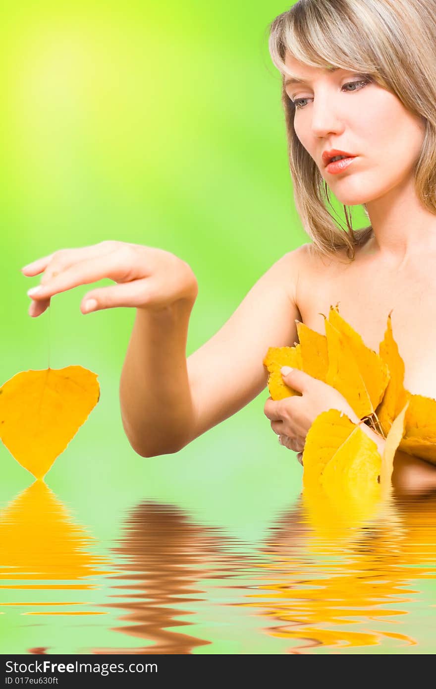 Portrait young woman with fall leafs