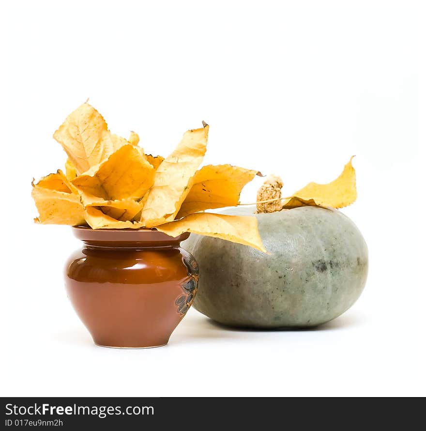 Fall leafs in vase and pumpkin