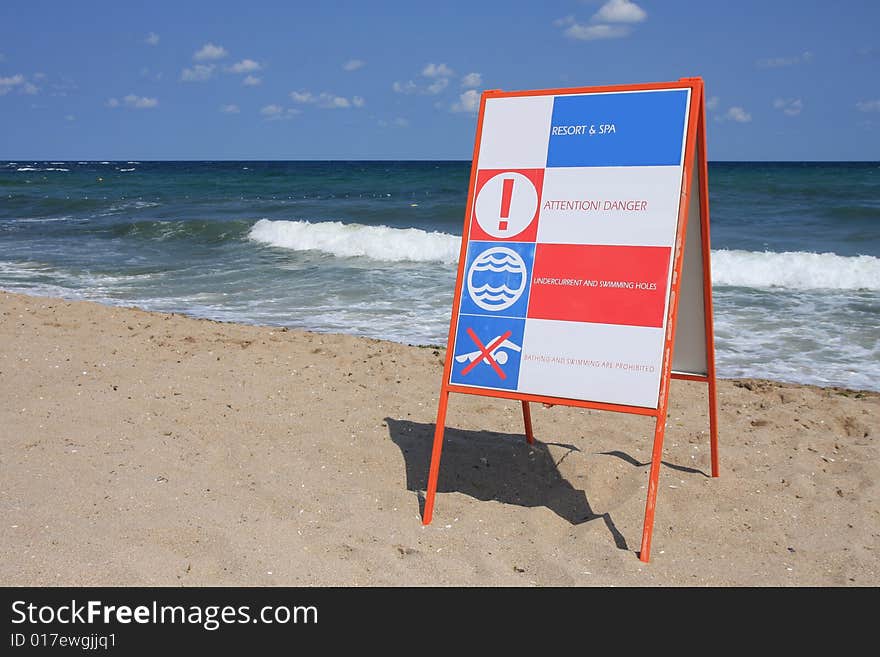 Sign Attention! Danger on the beach. Sign Attention! Danger on the beach.