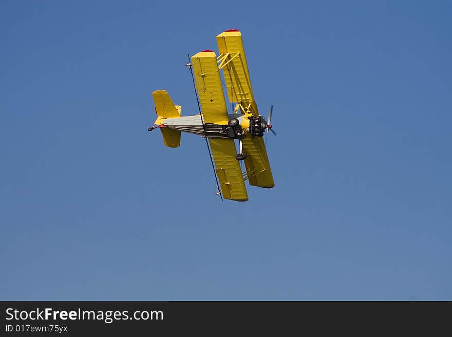 Yellow airplane in the sky