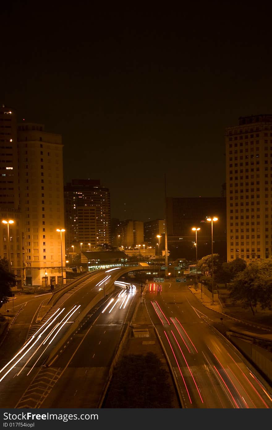 Above view of highway where can see Red and White lights of Fast cars on the street. Above view of highway where can see Red and White lights of Fast cars on the street