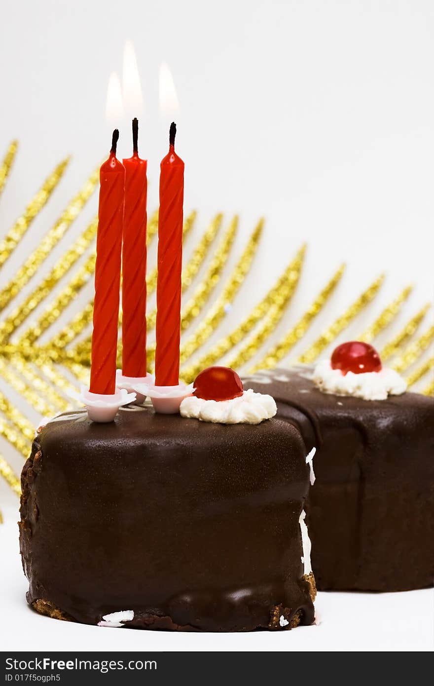 Cake with candles and leaf