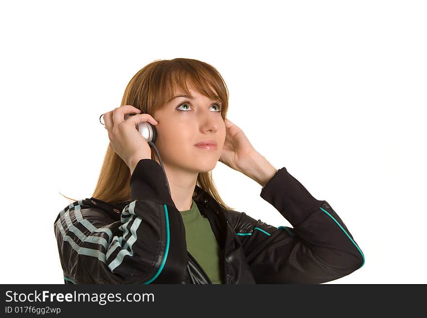 Young girl listening to the music isolated on white background. Young girl listening to the music isolated on white background