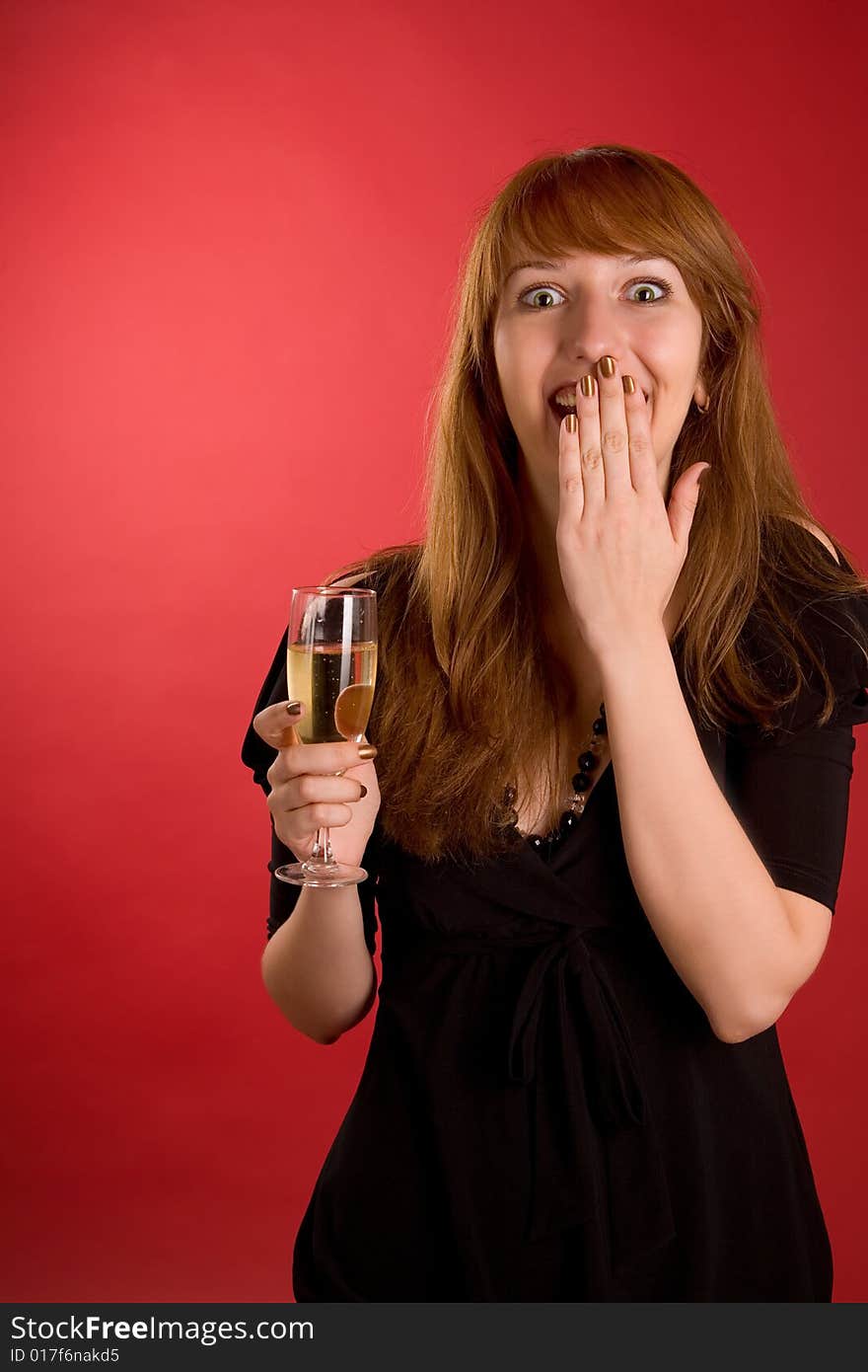 Surprised girl with champagne glass