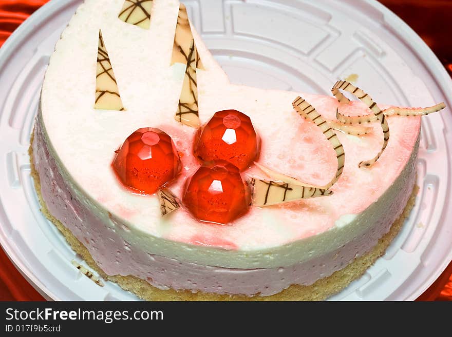 Piece of cake with red decoration