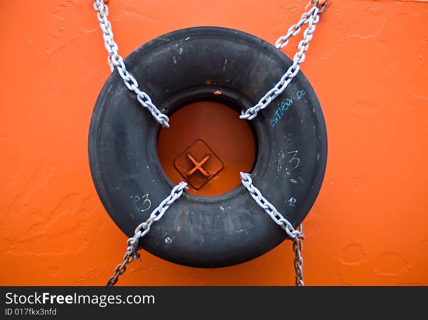 A chain fixed tire on a ship. A chain fixed tire on a ship