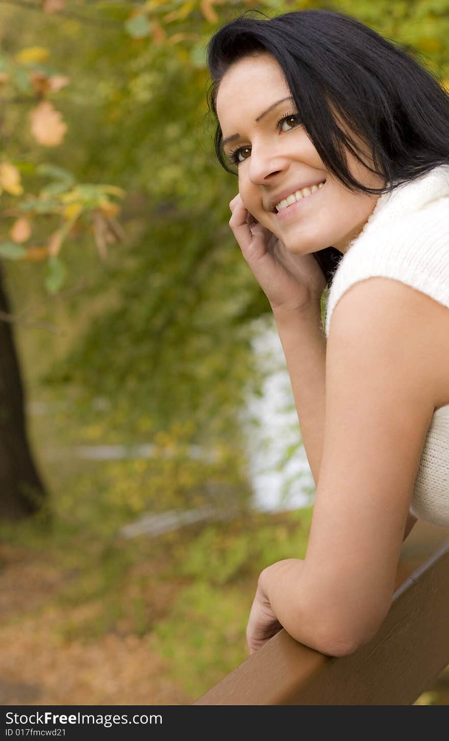 Beautiful woman looking outdoor the fall. Beautiful woman looking outdoor the fall