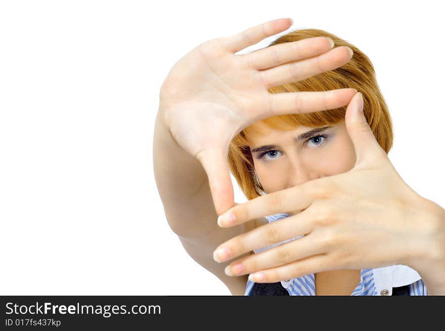 Pretty ginger woman whows frame with hands, isolated on white