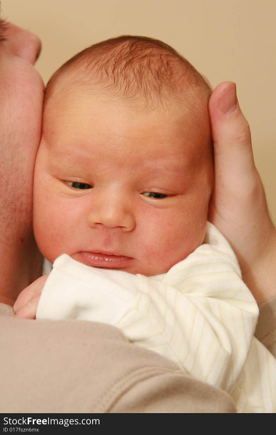 Father holding newborn baby - 5 days old baby. Father holding newborn baby - 5 days old baby.