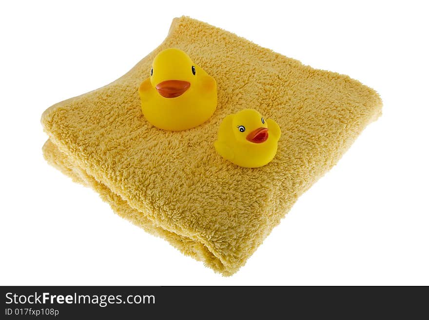 Rubber duck sits on towel