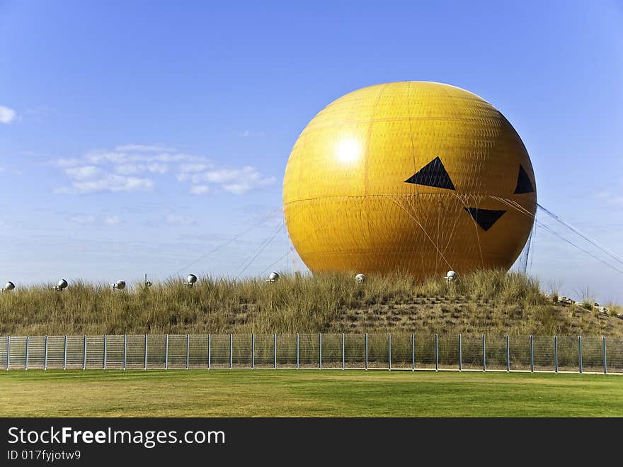 Orange Hot Air Balloon Resting on Ground