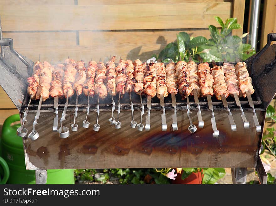 Roasted shish kebab on the grill. Roasted shish kebab on the grill.