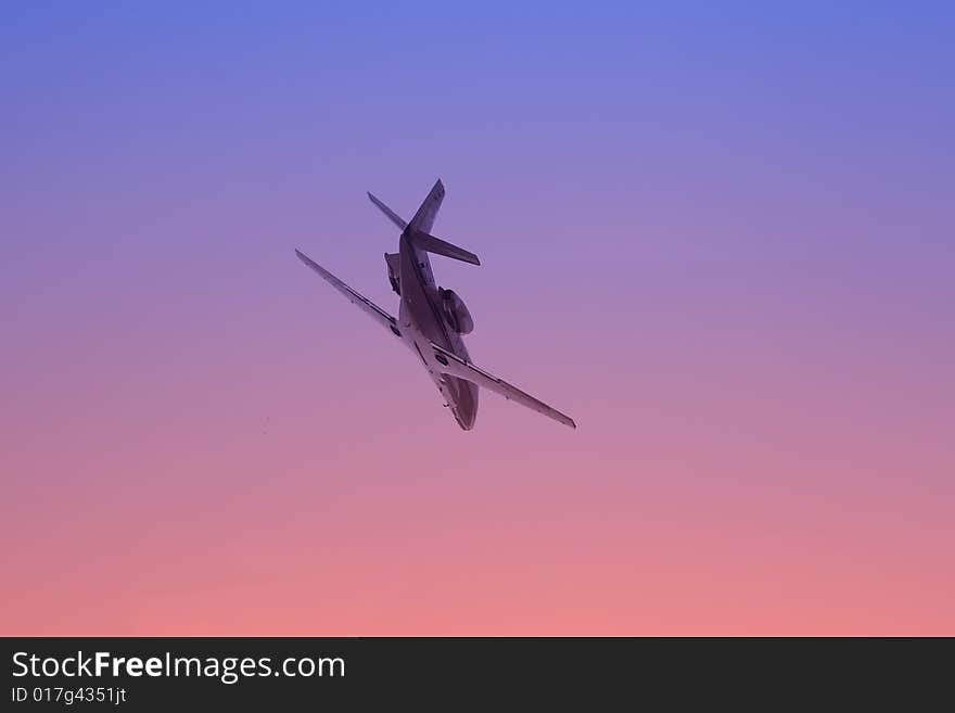 Airplane in the sky on sunset