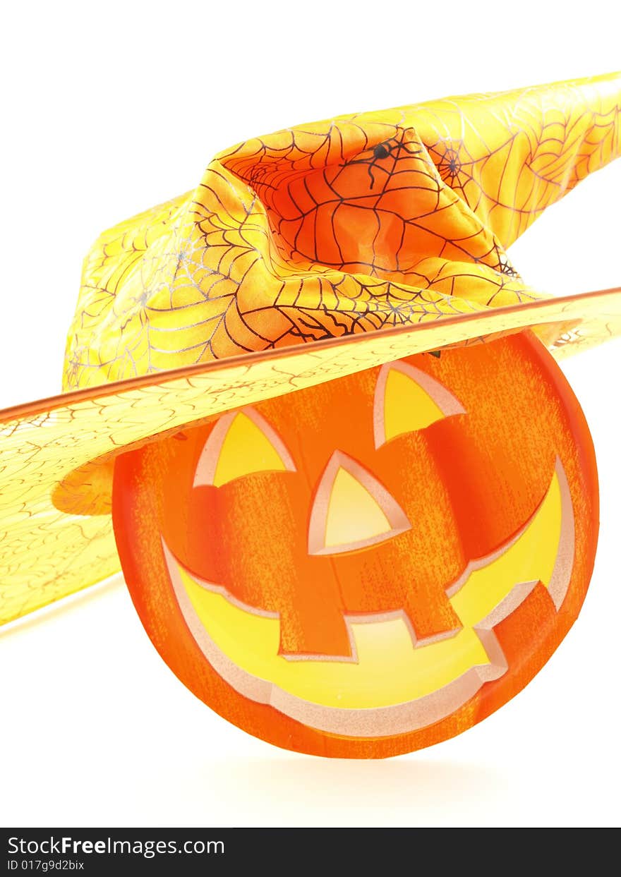 Halloween witch - wearing a hat with spider webs' pattern; smiling face of pumpkin. Halloween witch - wearing a hat with spider webs' pattern; smiling face of pumpkin.