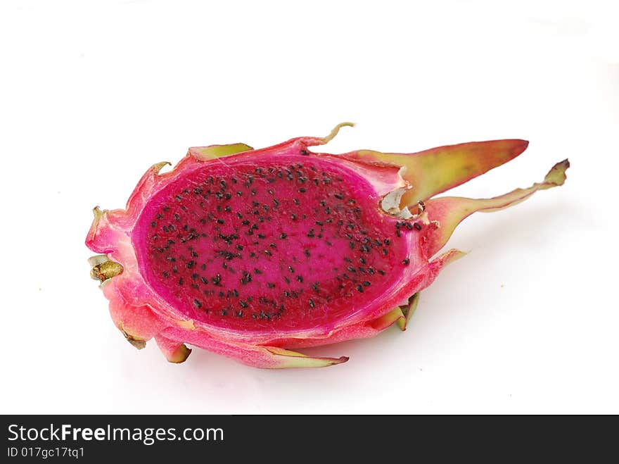 A longitudinal section of dragon fruit isolated on white background