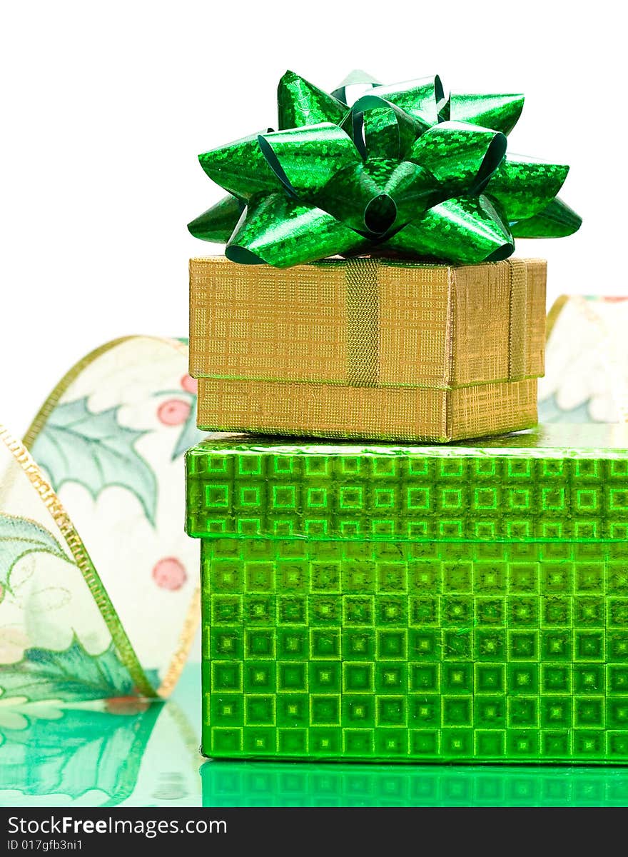 Green and golden gift box with ribbon