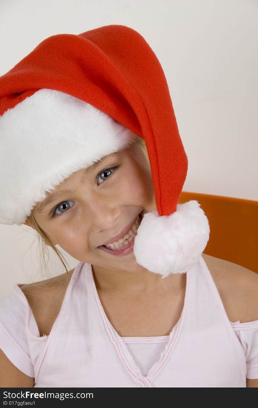 Smiling Little Girl Wearing Christmas Hat