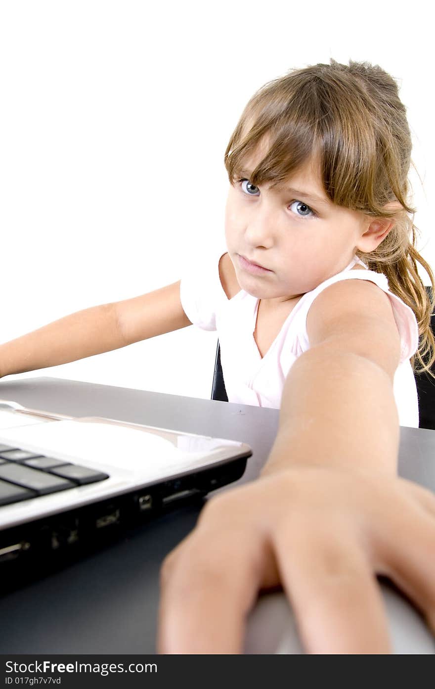 Little girl with laptop looking at the camera