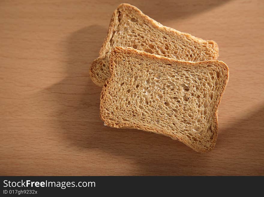 Two pieces of toast bread on a table