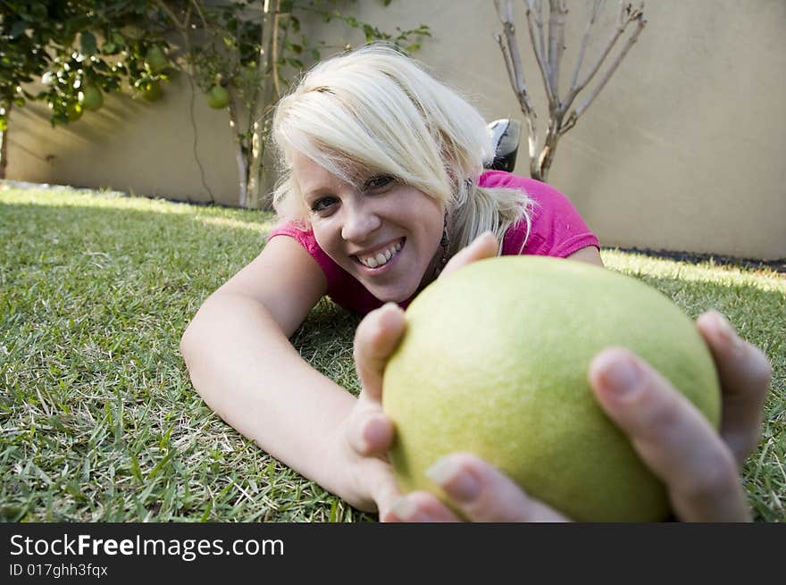 Caucasian woman posing with sweet lime