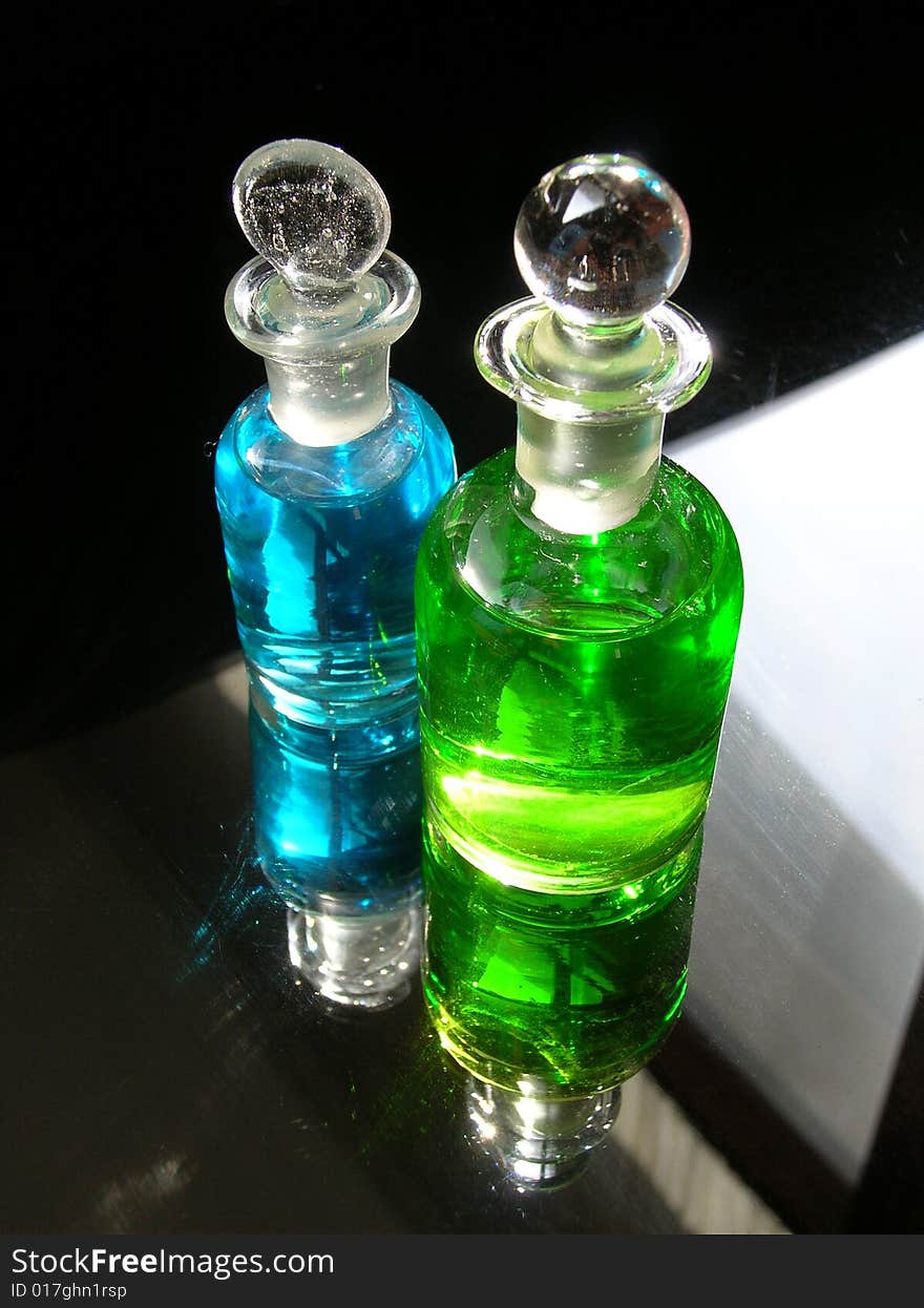 Two unusual bottles filled with mysterious liquids.