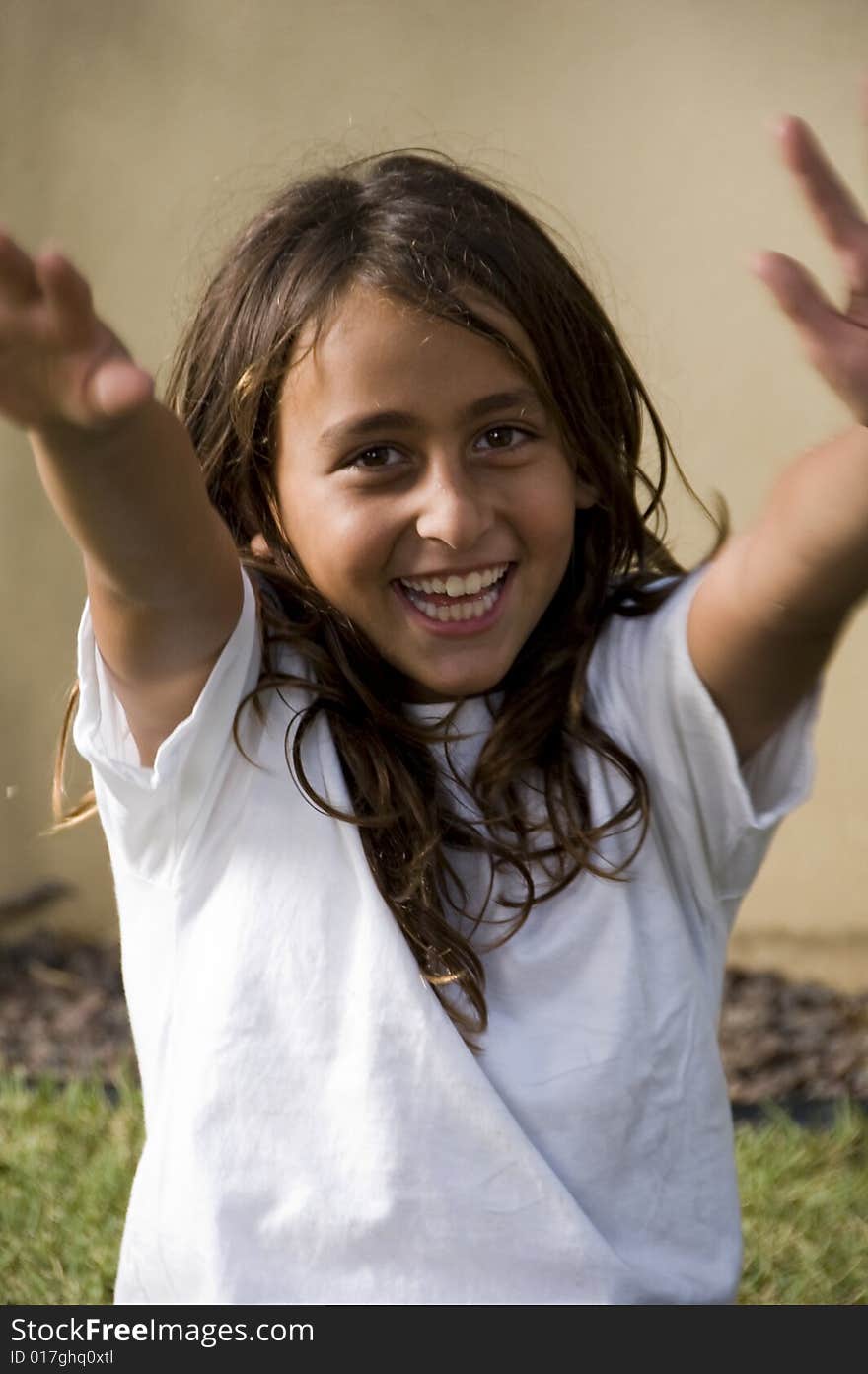 Happy young boy posing in the garden