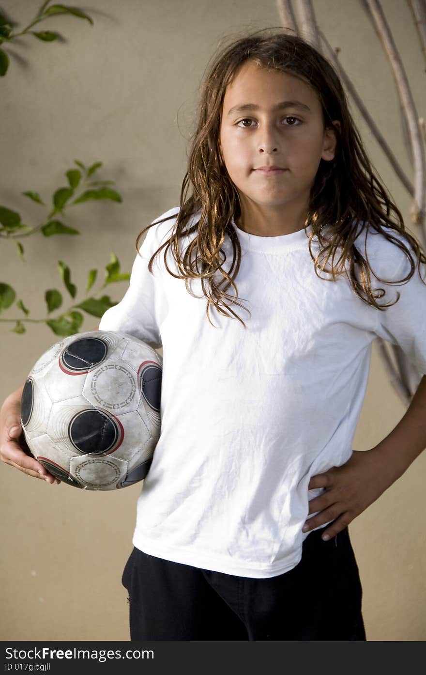 Tired boy standing with soccer ball. Tired boy standing with soccer ball