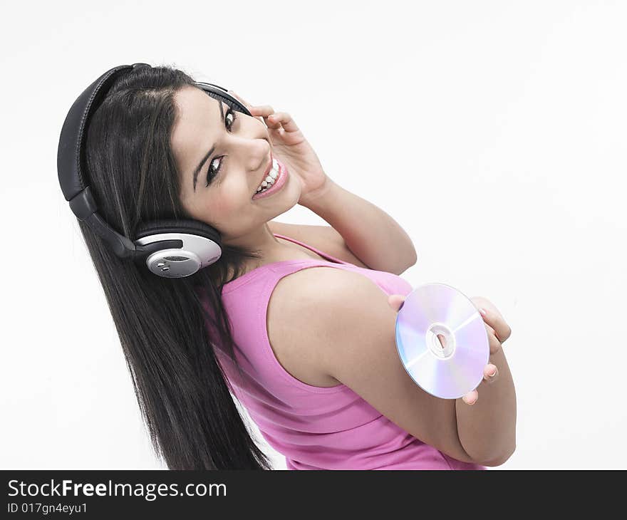 An asian girl of indian origin enjoying music. An asian girl of indian origin enjoying music