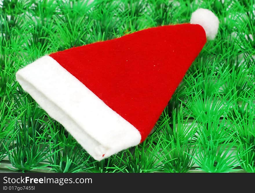 Santa hat image on the green grass background