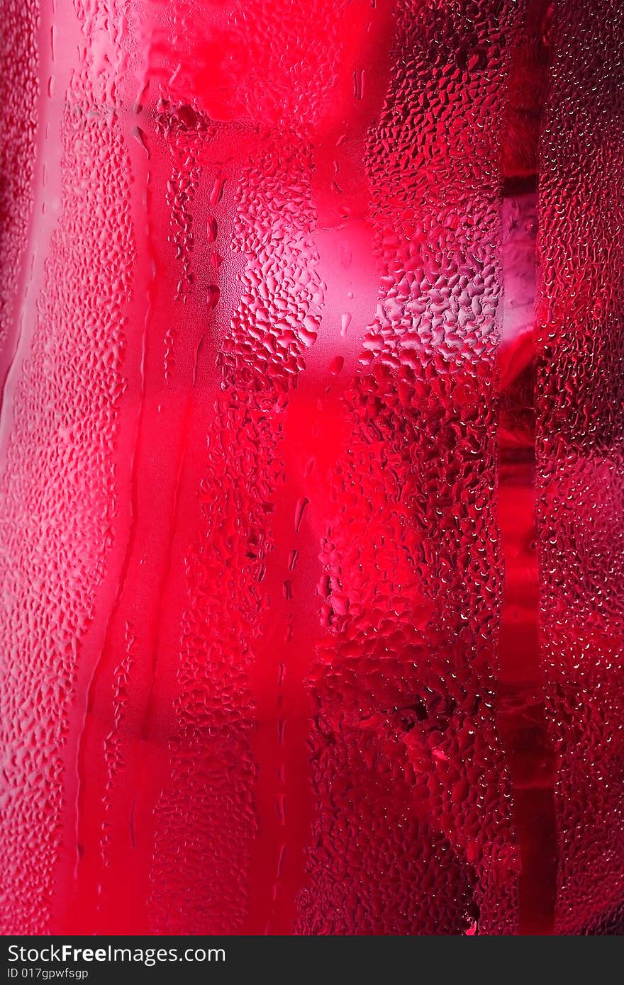 Water drops on glass with ice for background