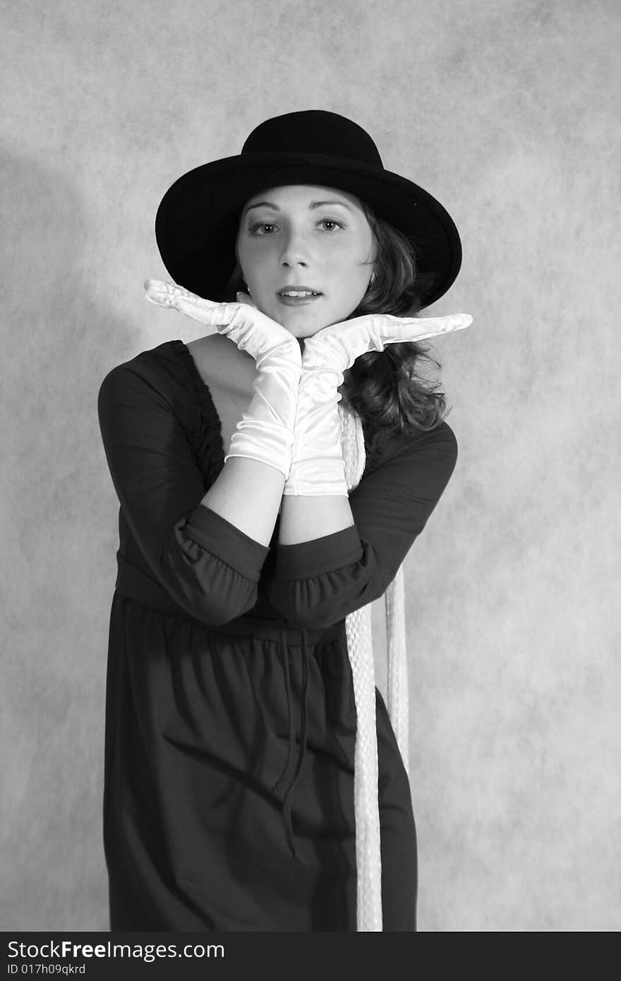 A girl in gloves with a hat