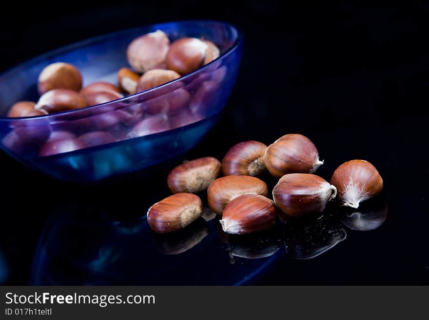 Chestnuts and blue plastic plate