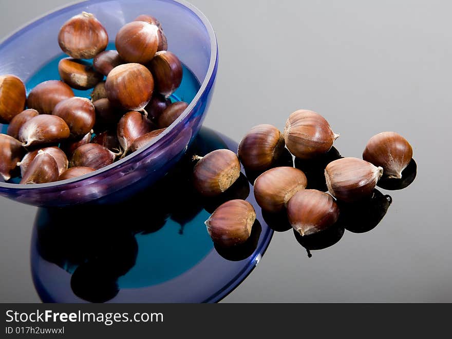 Chestnuts and blue plastic plate