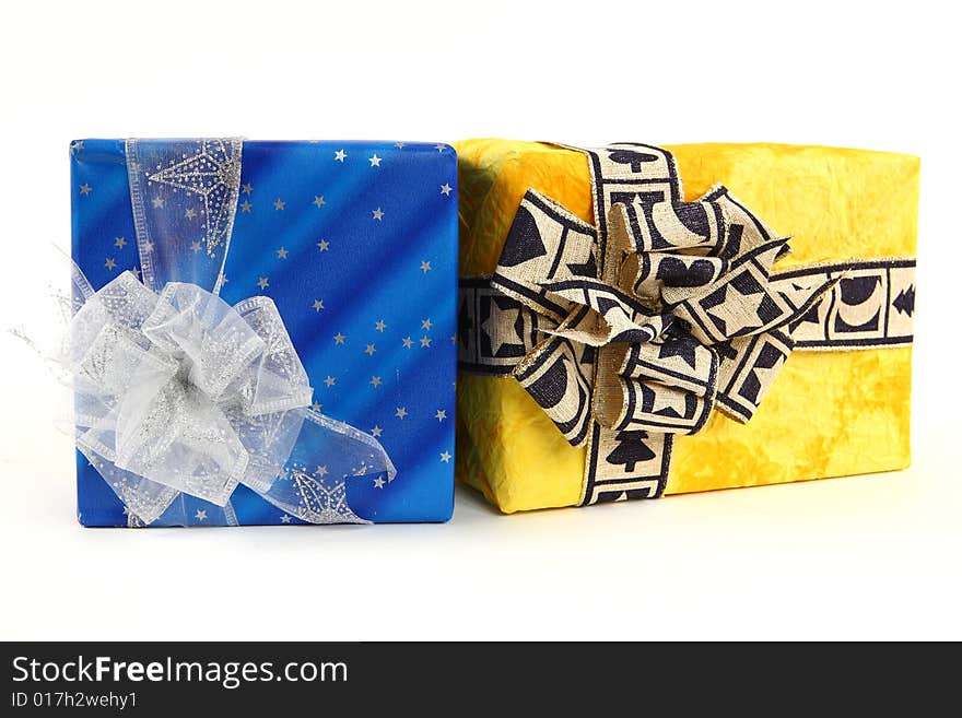 Two christmas presents with ties on white background