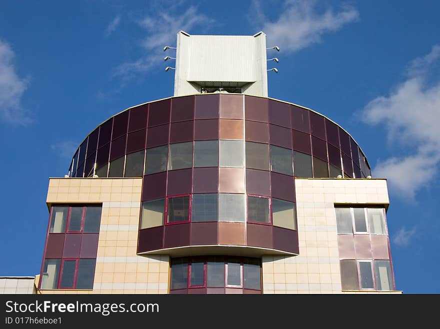 Modern building from a brick. Glass windows and balconies. Modern building from a brick. Glass windows and balconies.