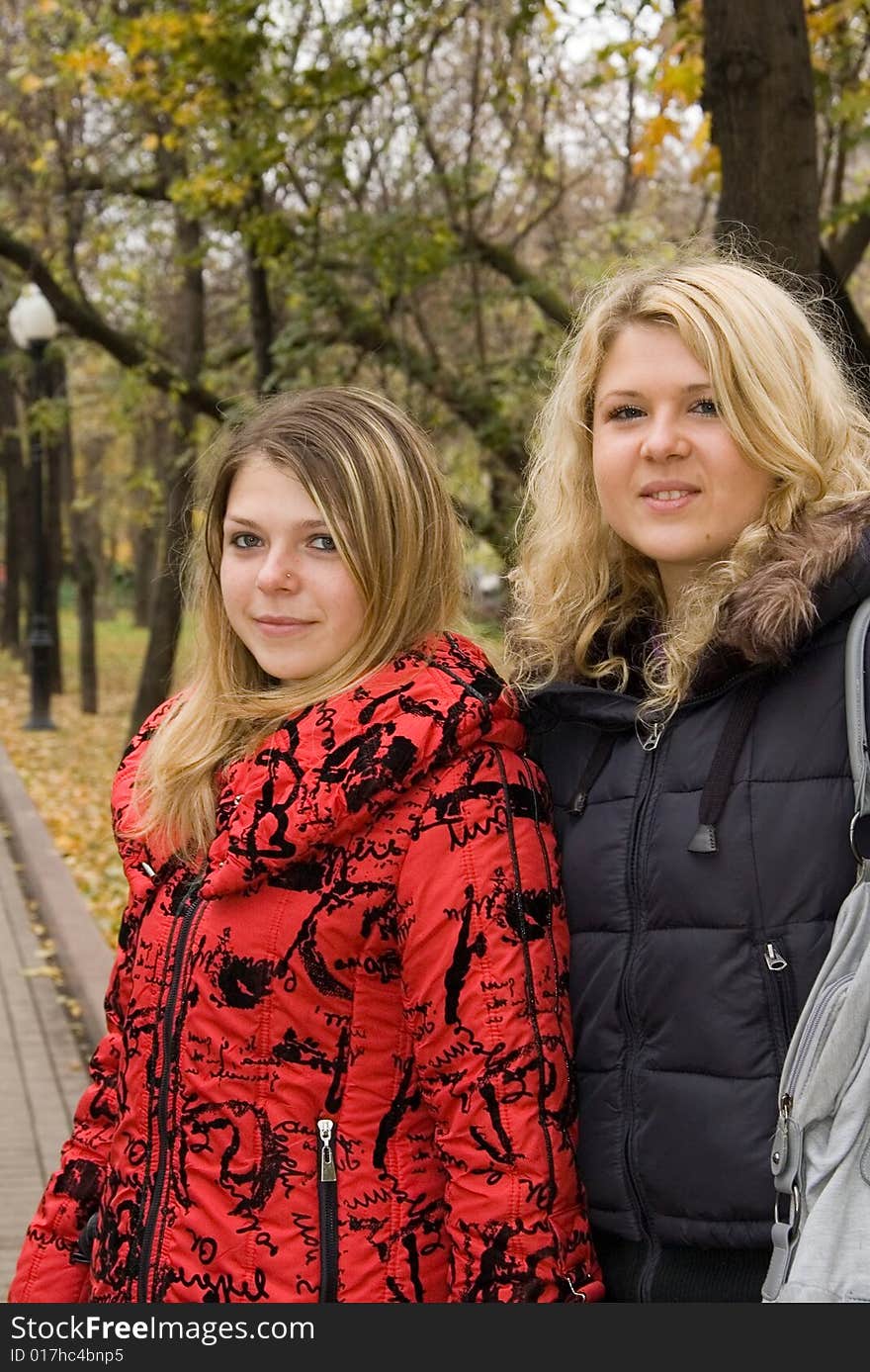 Two young women in a autumn park