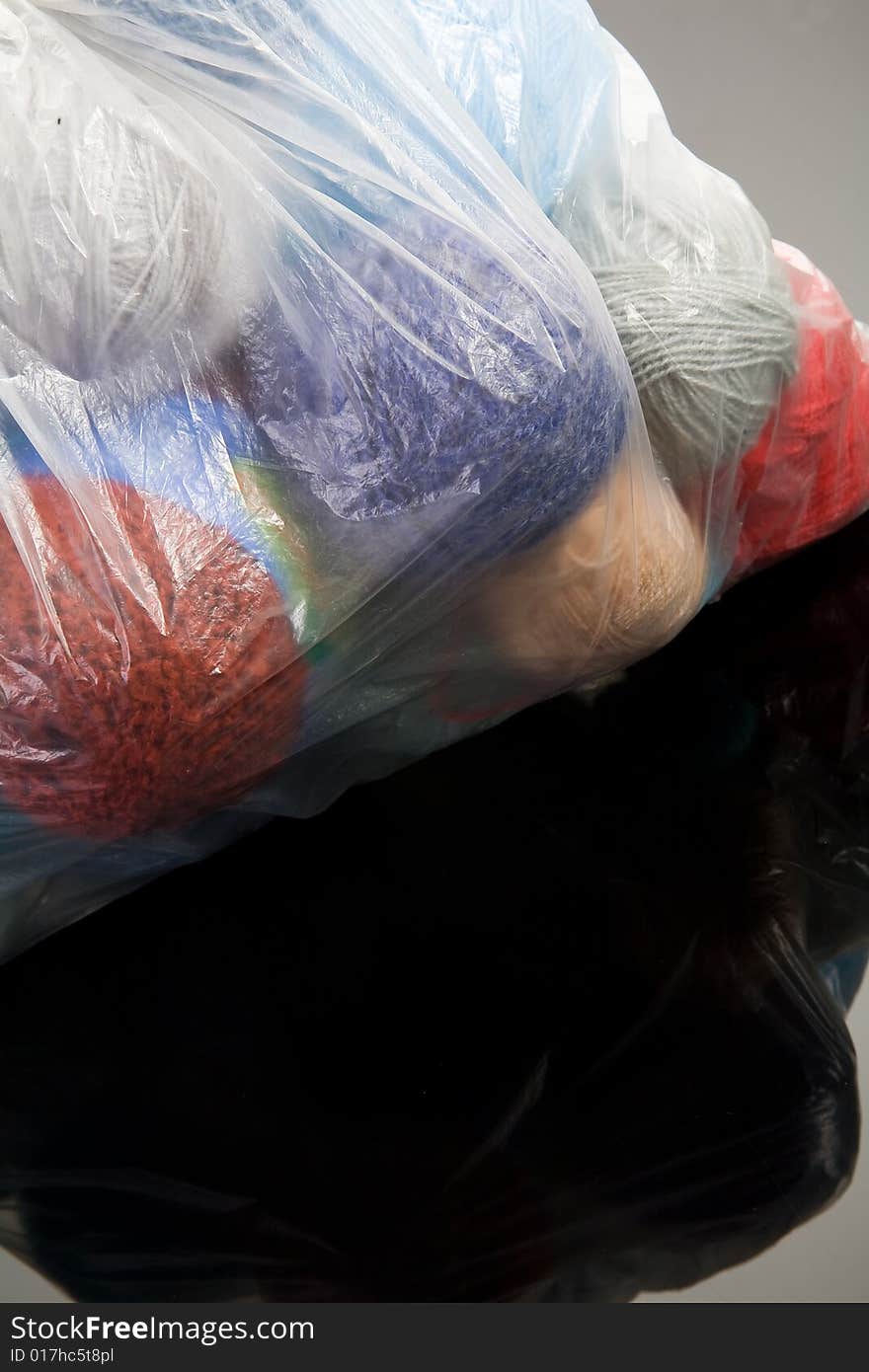 Threads in transparent plastic bag