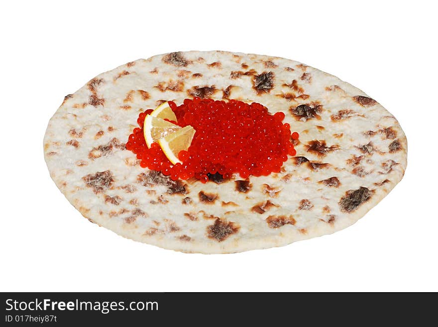 Red caviar  with lemon on  ethnic flatbread (isolated)