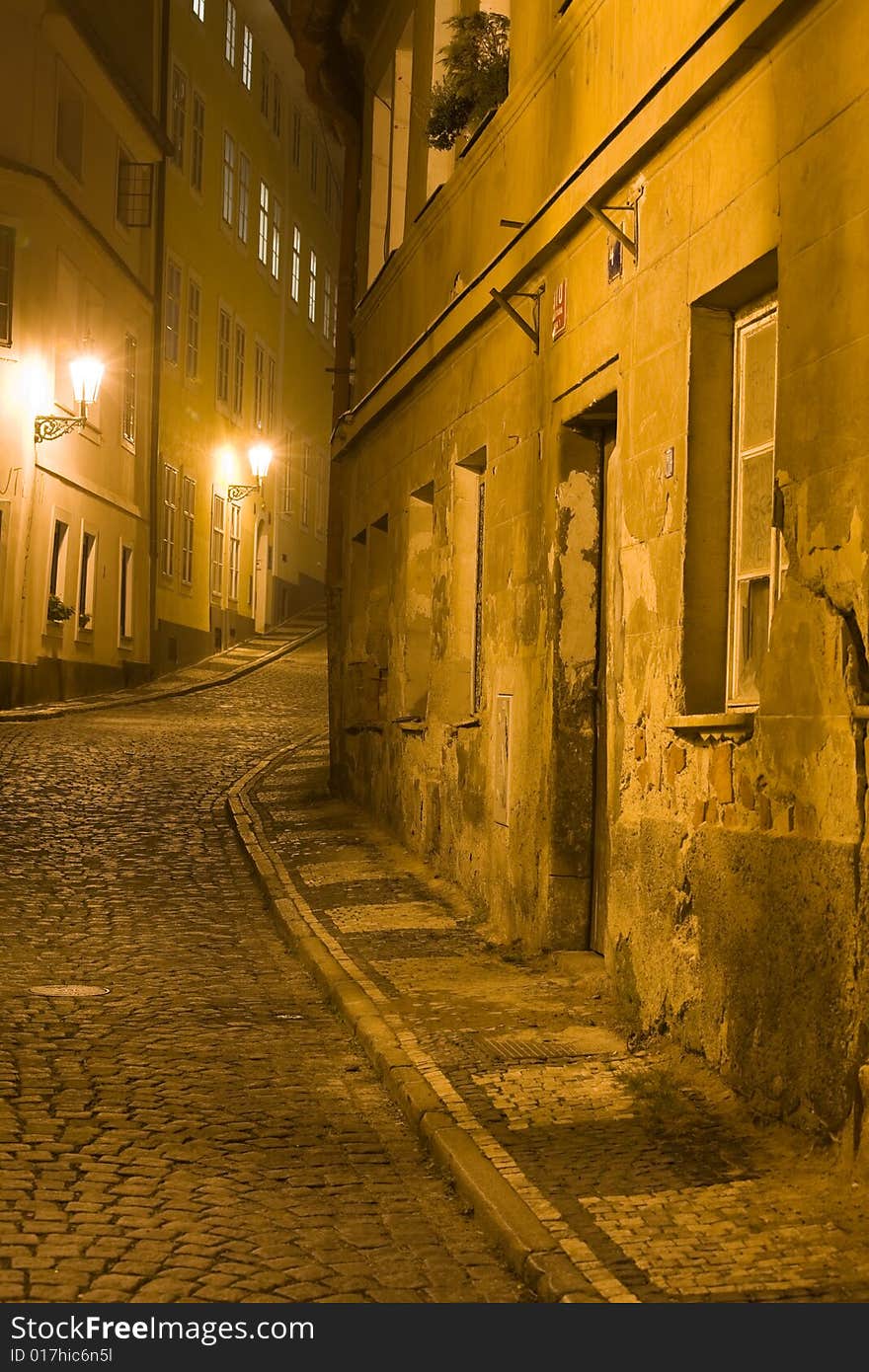 Old lane in Prague Little Quarter at night lighting.